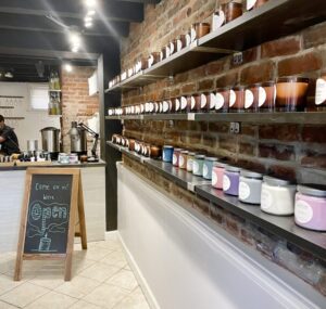 Photo inside the Alexandria studio with sample candles on shelves