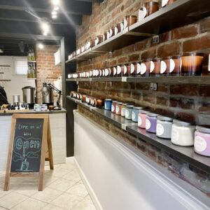 Photo inside the Alexandria studio with sample candles on shelves